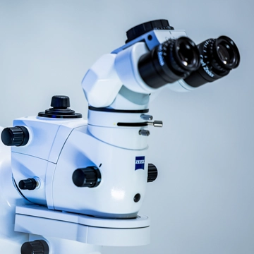 The image shows two optical telescopes with eyepieces positioned as if one were looking through them. 